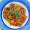 Farro tiepido con peperoni e salsiccia